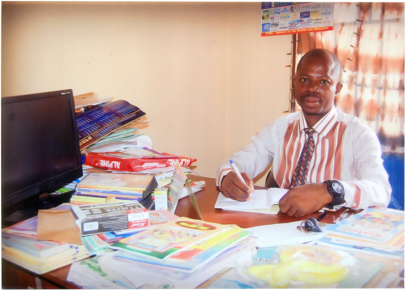 A Brown Group of Schools administrator working in the school office